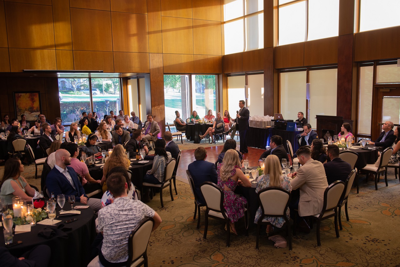 Dr. Peter Valenzuela speaking to an audience at a professional event